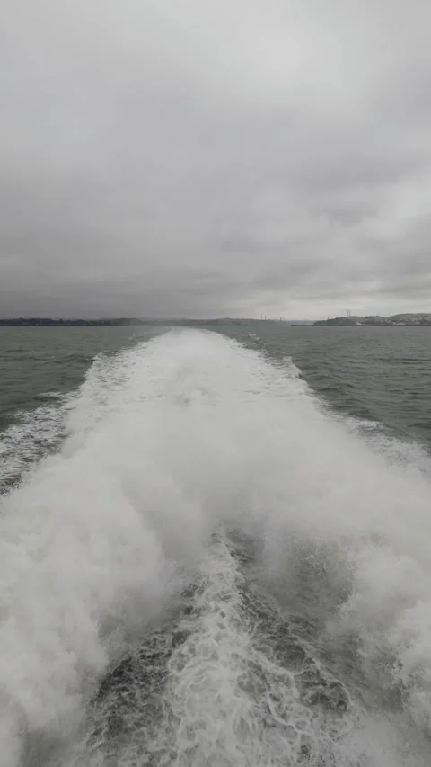 Vertical shot of white water wake behind a vessel Vídeo Stock 340001260