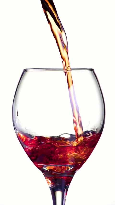 Vertical shot of wine being poured. Slow Motion. Stock-Footage 243460604