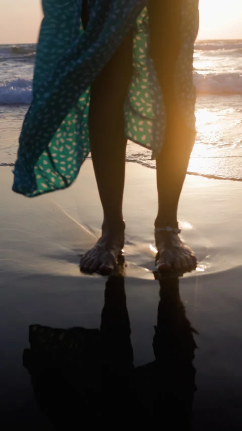 Vertical shot. Young and slim woman reflects on her lifes journey while enjoying Stock Footage 312756993