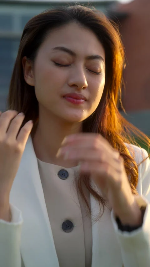 Vertical shot of young stressed beautiful asian business woman in elegant suit f Stock Footage 293936142