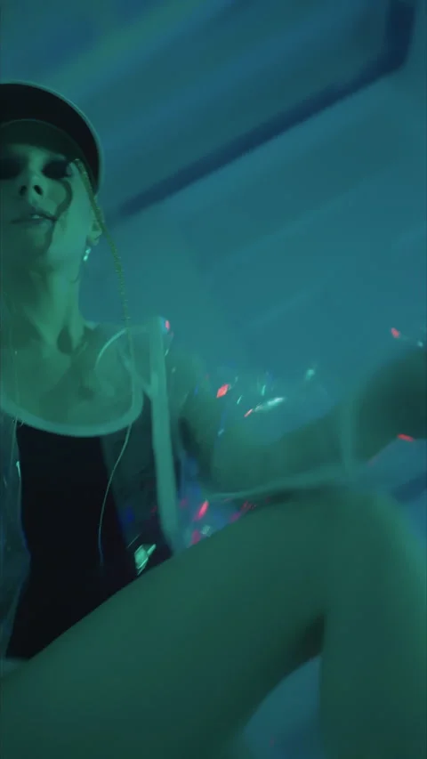 Vertical shot.fashion.slender model poses for camera in studio.red baseball Stock Footage 304116629