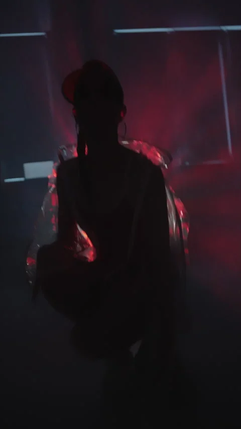 Vertical shot.fashion.slender model poses for camera in studio.red baseball Stock Footage 304118052