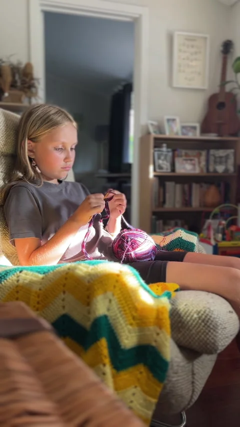 Vertical shots of a child knitting Stock Footage 299791427