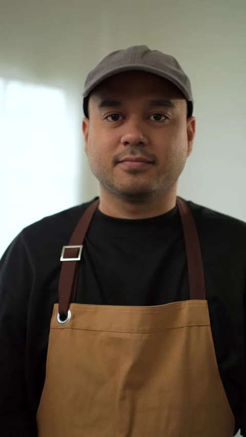 Vertical shots of portrait confident bartender barista or gardener man. Stock Footage 242476849
