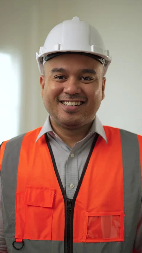 Vertical shots of portrait confident engineer with helmet safety smiling. Stock Footage 242481786