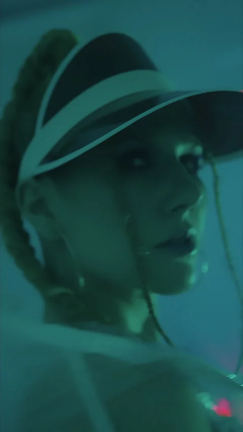 Vertical shot.slender model posing sexy on camera in studio. red baseball Stock Footage 304122633