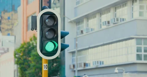 Vertical signal is holding green at intersection as controller is sending signal Stock Footage 339272333