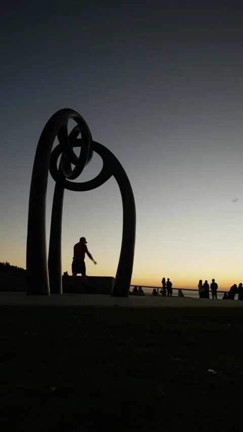 Vertical silhouette exercise at sunrise on Dolphins Point 6K Stock Footage 306951356