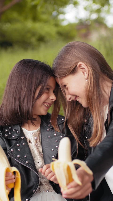 Vertical: Sisters with Bananas Stock Footage 316794441
