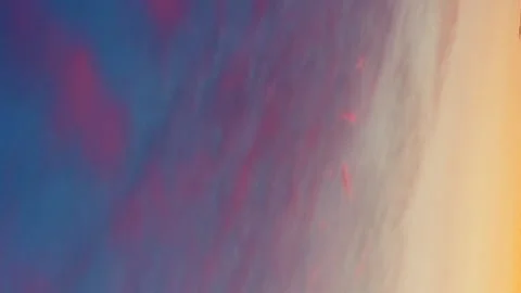 Vertical Sky time lapse during sunset time is a stunning display of warm co.. 動画素材 280179805