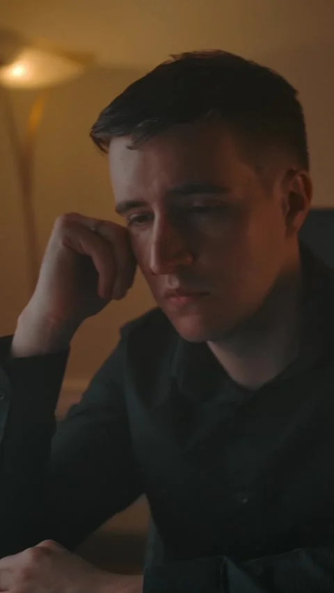 Vertical of Sleeping guy wakes up behind laptop, working at home. Stock Footage 276934797