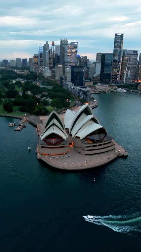 Vertical slow motion aerial view of sydney skyscrapers and pacific ocean Stock Footage 306163157