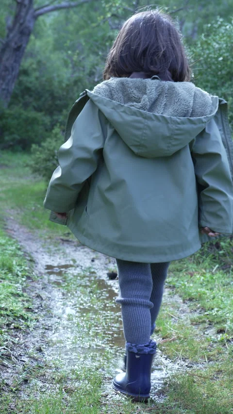 Vertical Slow Motion of Child Stepping into Water Puddle - Forest Series Vídeos de archivo 326171929