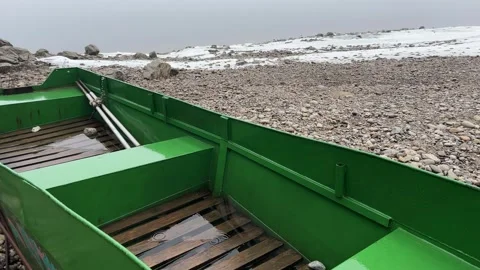 Vertical Slow Motion Close Up of Raindrops Falling into Green Metal Boat Stock Footage 328473616