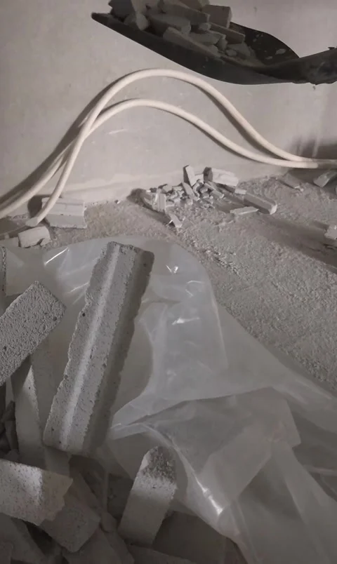 Vertical Slow Motion Construction Worker Shoveling Concrete Debris 스톡 동영상 344431704