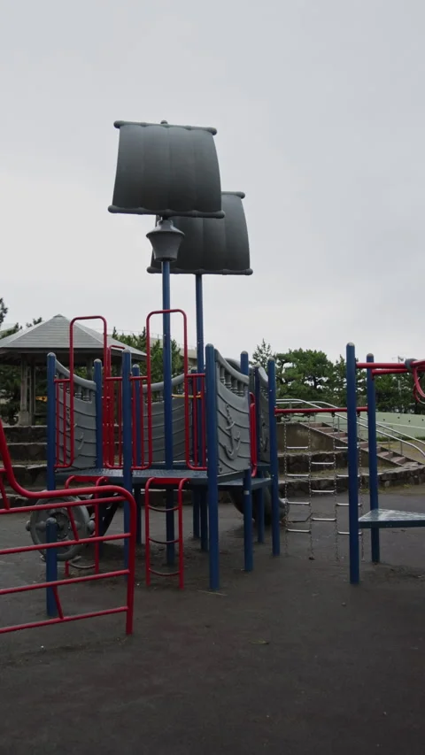 Vertical slow motion empty playground on a cloudy day in Japan Video stock 348584206