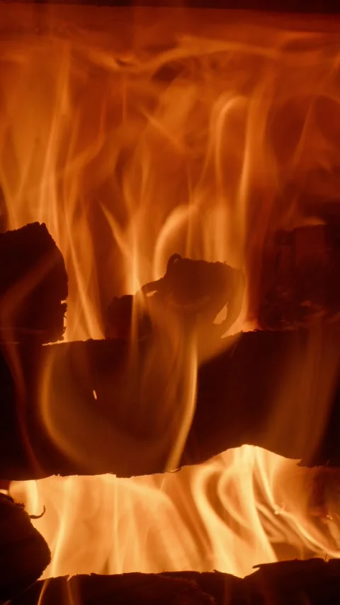 Vertical Slow Motion Fireplace with Dancing Flames and Flying Sparks Stock Footage 328833740