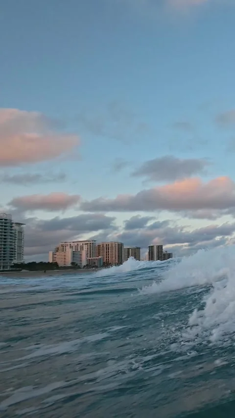 Vertical Slow Motion: Golden Hour Waves Crushing on a Florida Shore at Sunset Stock Footage 329553612