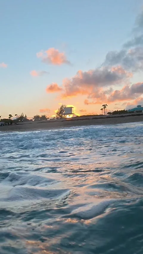 Vertical Slow Motion: Golden Hour Waves Crushing on a Florida Shore at Sunset Stock Footage 329553617