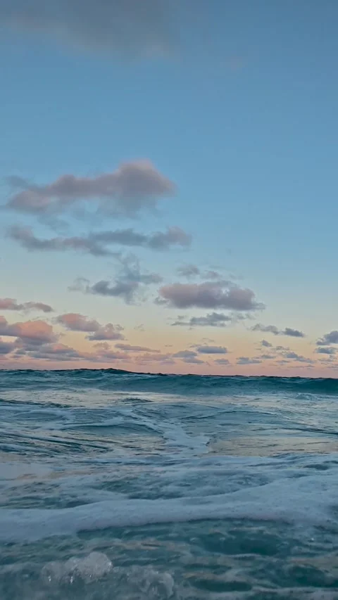 Vertical Slow Motion: Golden Hour Waves Crushing on a Florida Shore at Sunset Stock Footage 329553620
