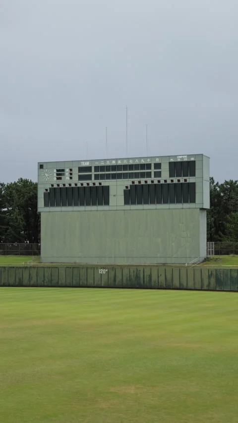 Vertical slow motion pan of a baseball stadium scoreboard in Japan Video stock 348586635