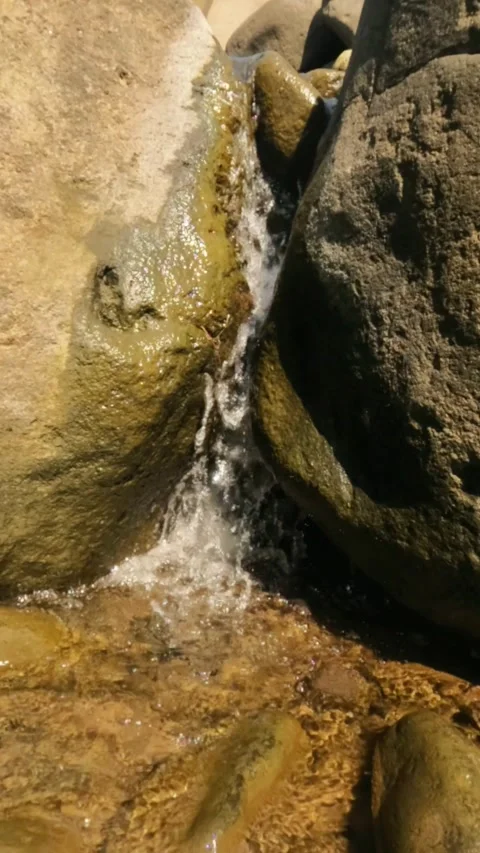 Vertical slow motion of a river cascade with clear water Stock Footage 321860400