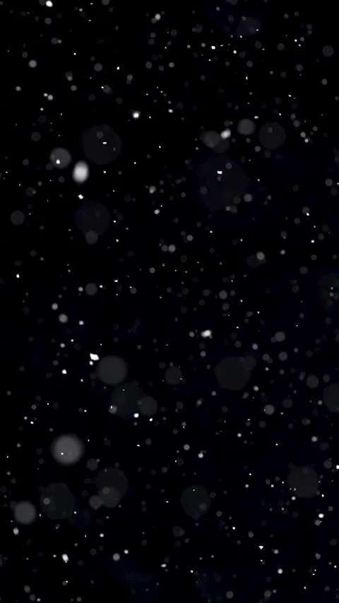 Vertical slow motion of snow falling on black background Stock Footage 307704359