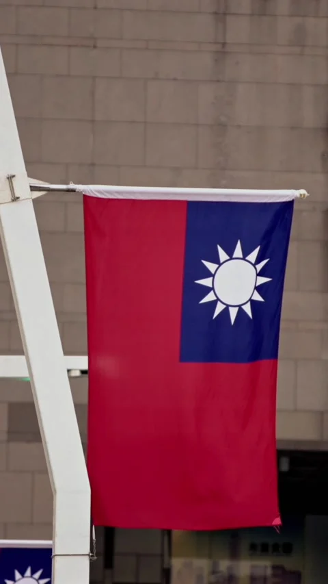 Vertical Slow motion of Taiwan flag against a clear sky backdrop Stock Footage 316700286