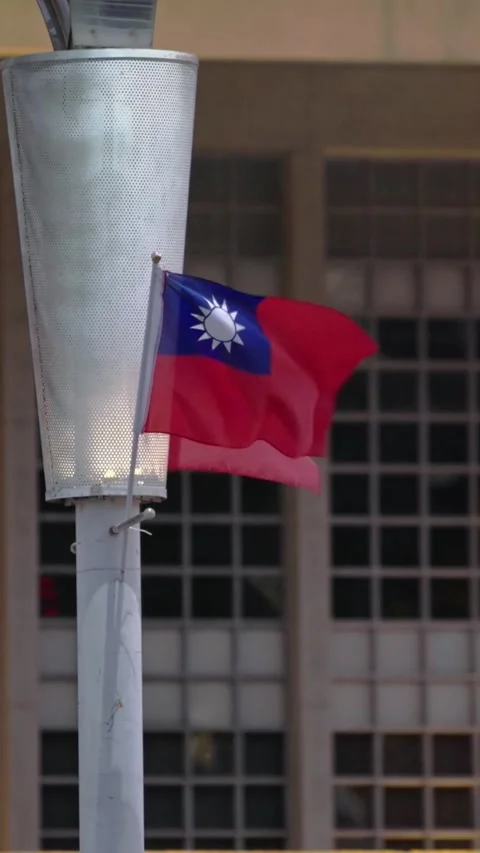 Vertical Slow motion of Taiwan flags with urban backdrop Stock Footage 314466318