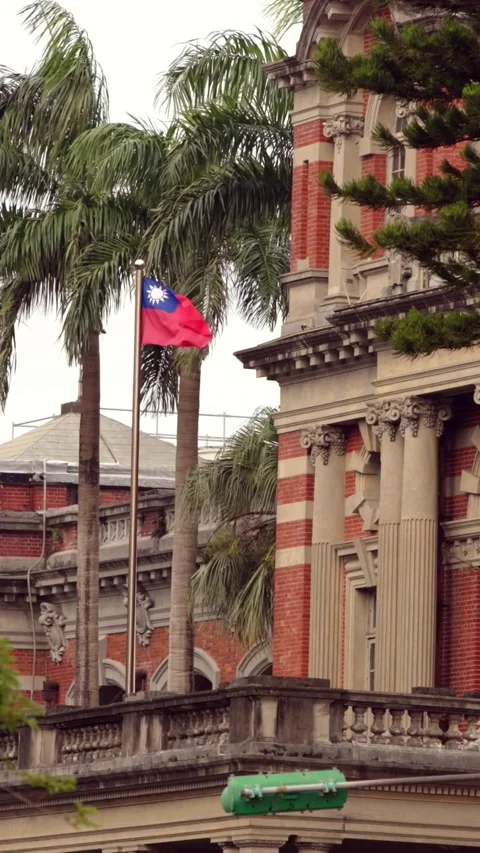 Vertical Slow motion of Taiwan flags waving along a rooftop fence Stock Footage 314466349