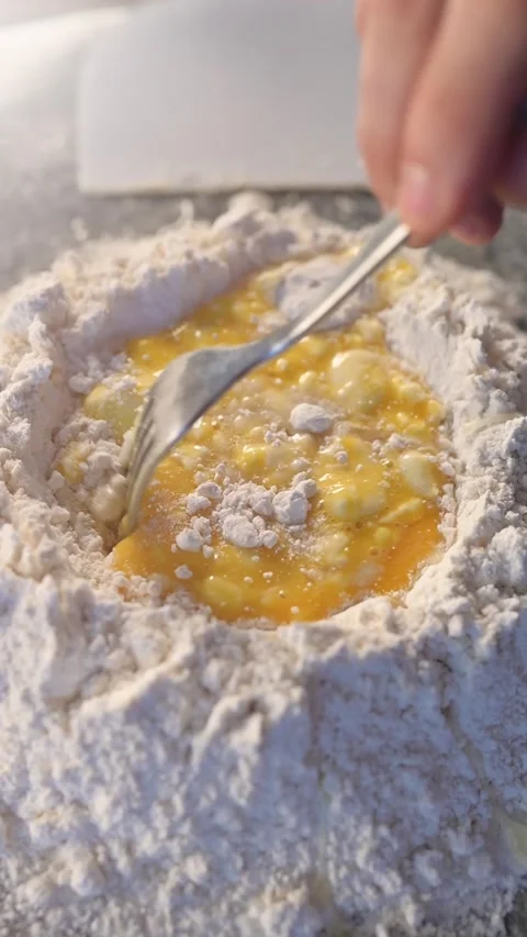 Vertical slow motion video. Mixed the dough. The process of making a delicious h Stock Footage 134056464