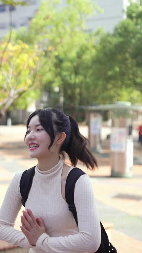 A vertical slow-motion video of two young Taiwanese female college students 動画素材 266362729