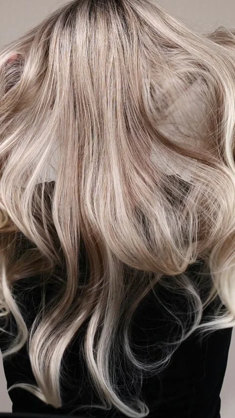 Vertical slow motion video of unrecognizable model with long blond straight hair Stock Footage 287416093