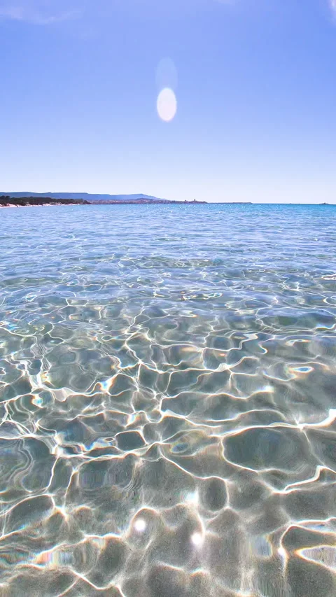 Vertical slow motion view of caustics on clear water in Alghero Stock Footage 337116560