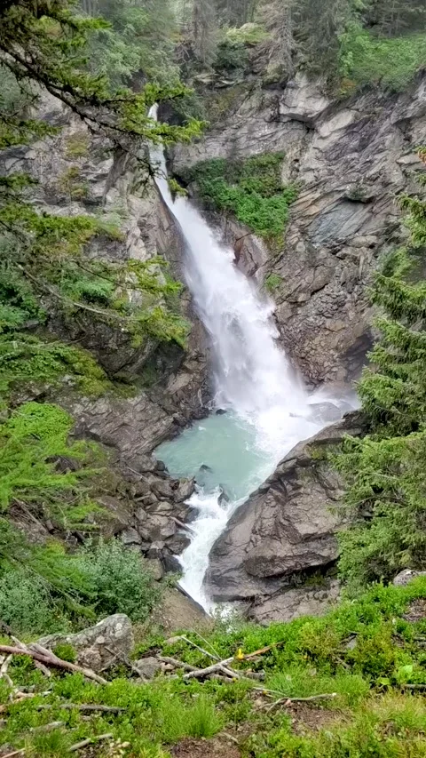 Vertical Slow Motion Waterfall on Alps Stock Footage 159023980