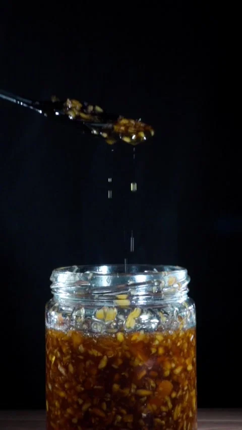 Vertical Slow Motion Zoom Out Reveal of Minced Fermented Ginger Honey Stock Footage 324921463