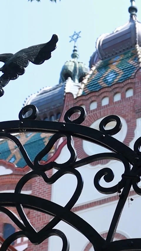 Vertical Slow Pan Left Revealing Synagogue Exterior Through Iron Gate Stock-Footage 330368923