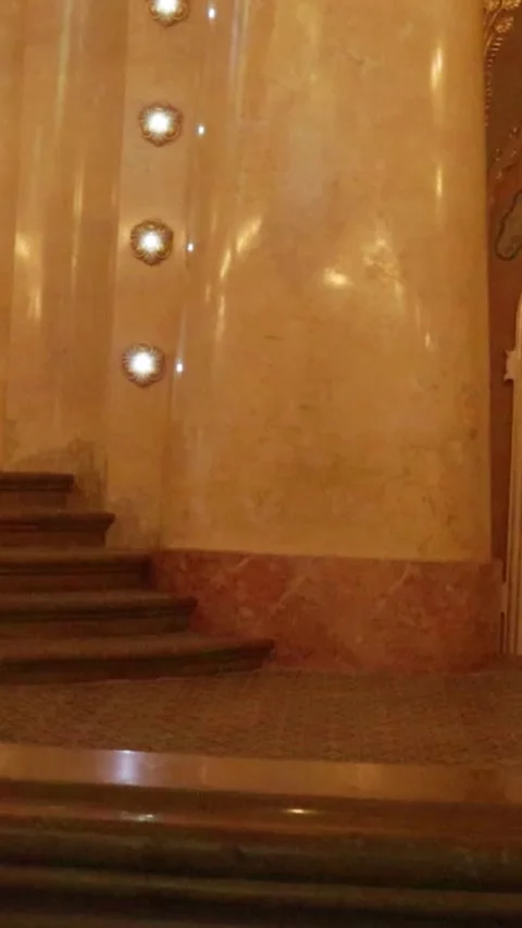 Vertical Slow Pan Left Revealing Carved Doors and Wall Sconces in Synagogue Stock-Footage 331135597