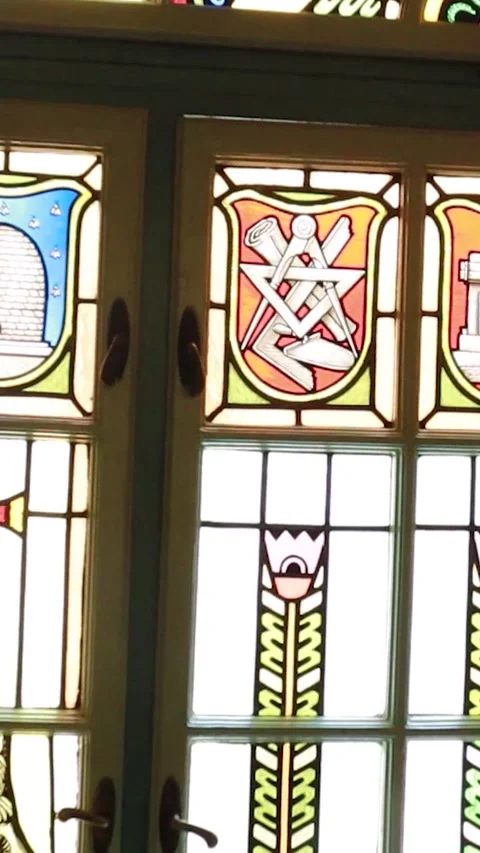 Vertical Slow Zoom on Decorative Stained Glass Window Symbols Stock-Footage 330368425