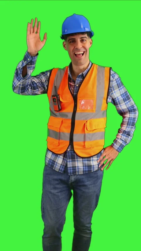 Vertical Smiling construction engineer waving at the camera, wearing orange.. Stock Footage 287327968