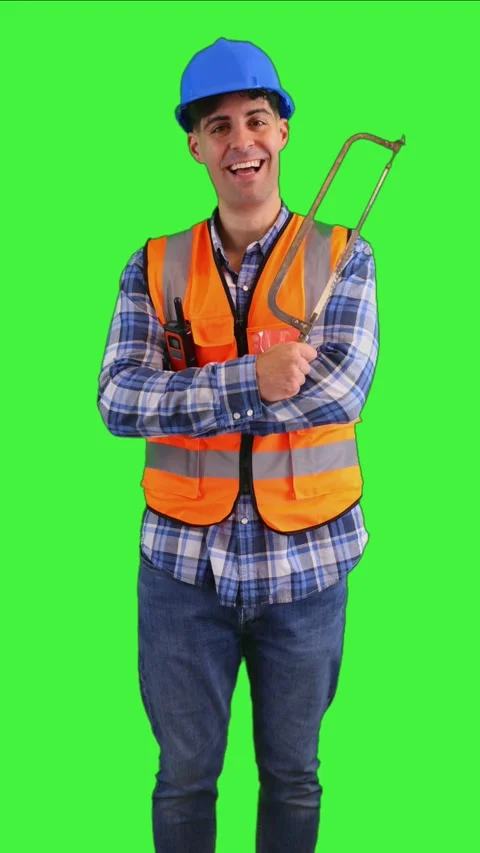 Vertical Smiling construction worker holding a handsaw wearing orange vest .. Stock Footage 287328003