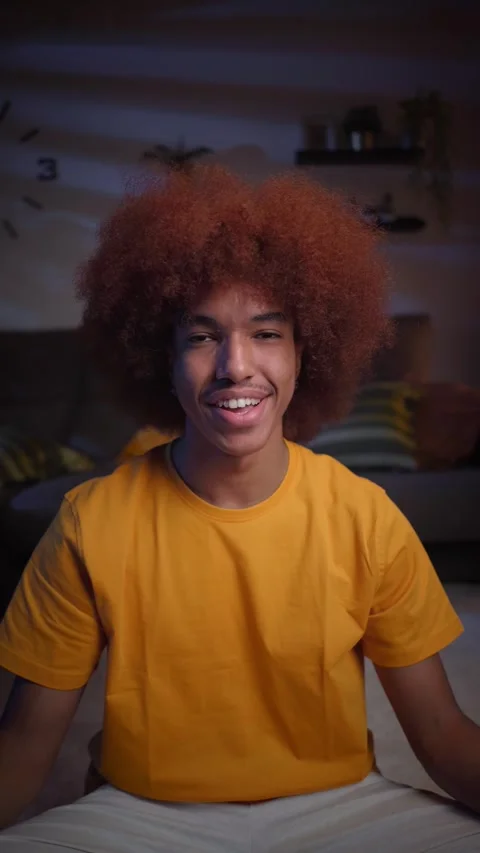 Vertical smiling young Latin man living room at home. African American looking Stock Footage 248866029