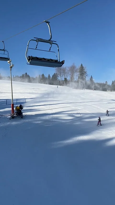 Vertical - Snow Cannon Making Artificial Snow on Ski Slope in Sunny Resort⁠ Stock Footage 345237575