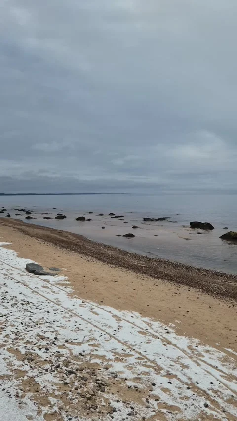 Vertical Snowy Beach With Rocks Stock Footage 322051893