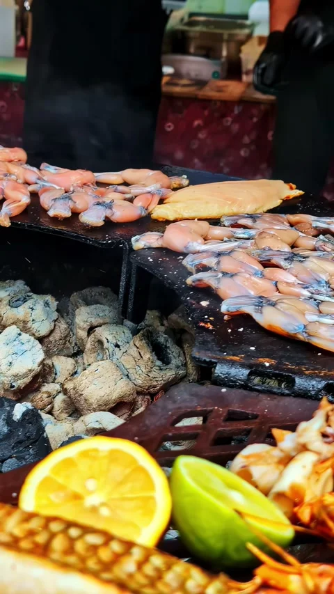 Vertical social ratio close-up video of various vegetables and meats on a fire Stock Footage 337127659