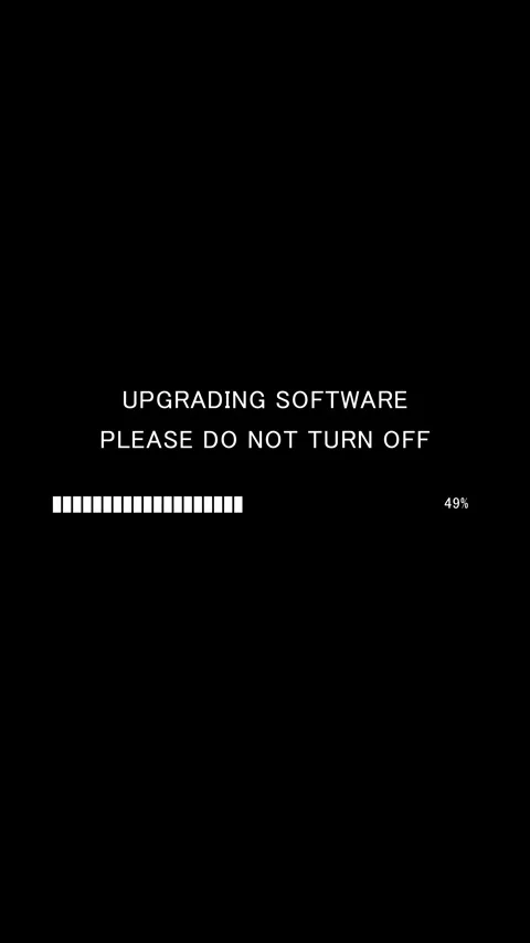Vertical software upgrade progress bar with do not turn off message on black Vídeo Stock 338371344