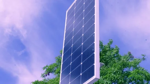 Vertical solar panel capturing sun energy against blue summer sky Stock-Footage 335603243