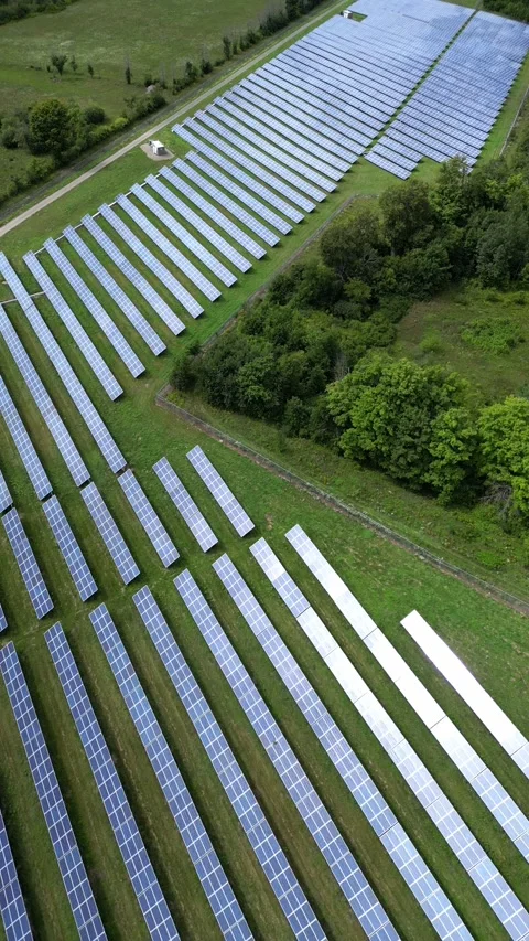 Vertical Solar Panel Farm Grid Electric Power Green Energy Plant with Drone Stock Footage 295508557