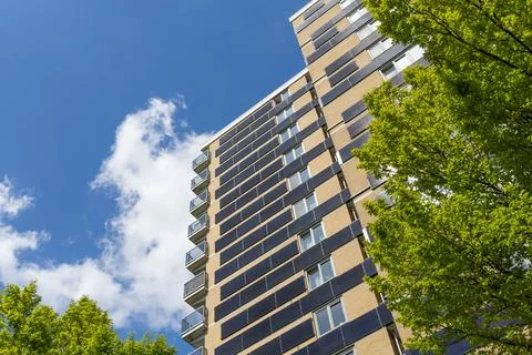 Vertical solar panels flat on walls of apartments. Stock Photos