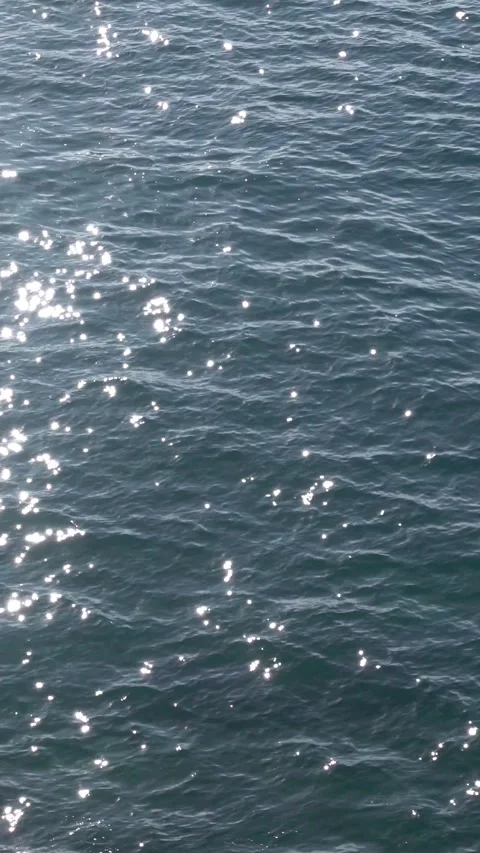 Vertical sparkling sea surface, deep blue water motion background Stock Footage 332788796